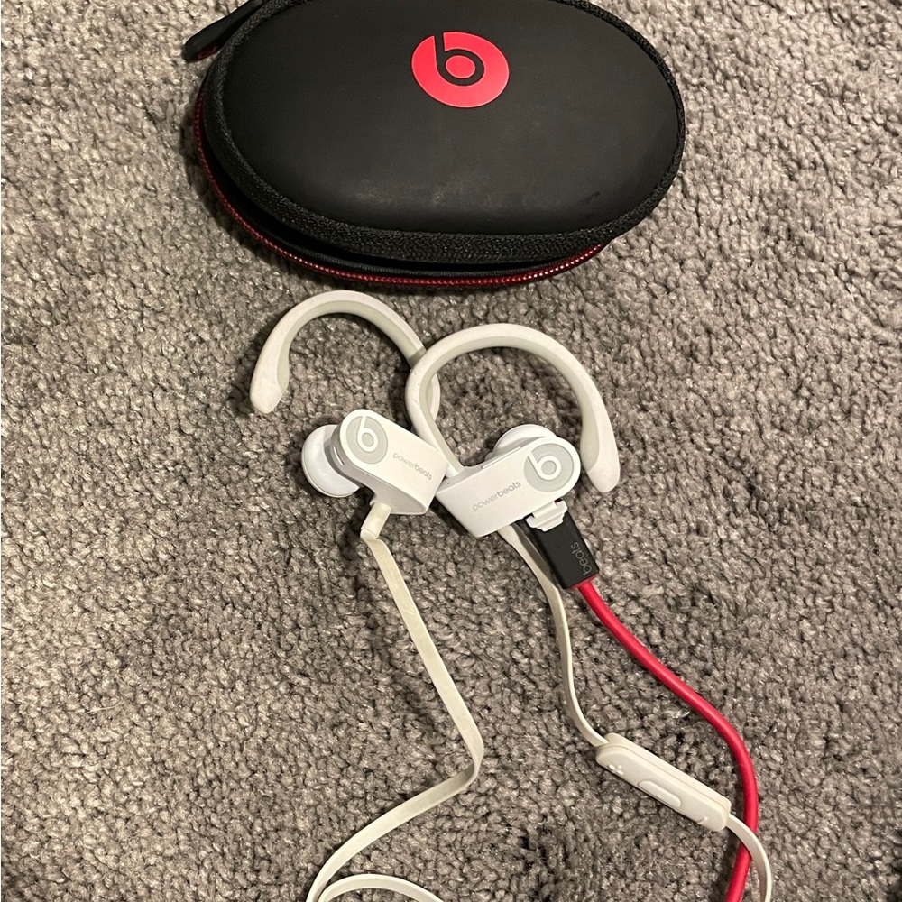 Beats by Dre, white headphones. Need to buy buds.
